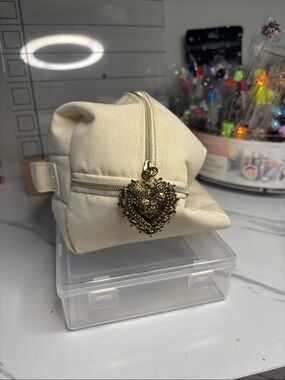 Dolce & Gabbana Cream Canvas Cosmetic Pouch with Gold Heart Charm